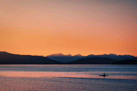 kayaking during the sunset over the lake