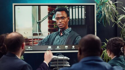 Team attends meeting with the business administrator to present a project briefing, addressing annual data reports and performance metrics via videocall conference online. Camera A.