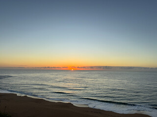 View of a sunrise over the ocean at a beach in Australia in Summer 