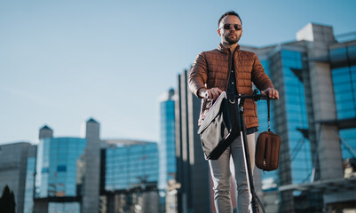 A stylish businessperson rides an electric scooter through an urban landscape, showcasing an...