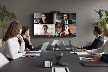 Four applicants on monitor screen, HR managers listen candidates at remote job interview, virtual...