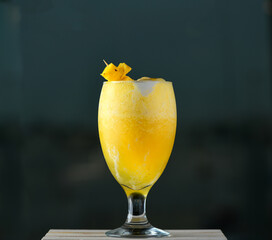 Pineapple ice cream mixed thick juice with a slice of fruit on glass