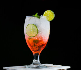 Pomegranate mojito with mint and lemon in a glass