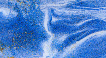 Closeup dust of pigment sparkling with blue fluid color