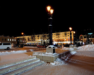 retro style lanterns on a winter night in the city center - 783491816