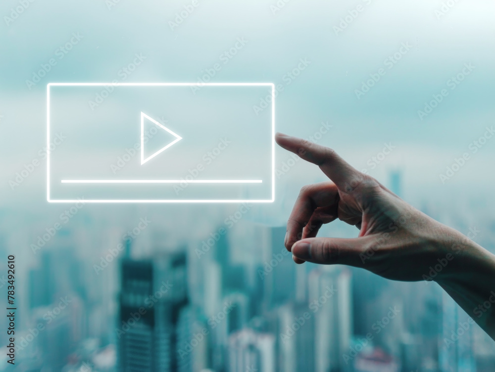 Poster a hand interacting with a neon play button hologram, urban skyline in the background, depicting a te