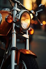 Close up of motorcycle with bright orange headlight