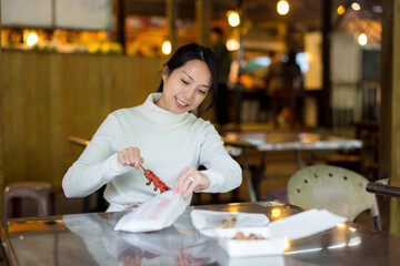 Woman enjoy her Taiwanese sausage at market