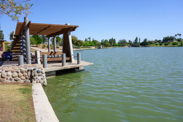 Front water side docking pier gazebo with chain barrier at lake Kiwanis park in Tempe, Arizona