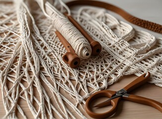 Weaving macrame. Materials for macrame. White and brown threads, wooden beads, scissors. Close-up on a white background
