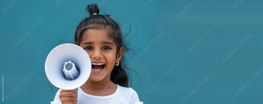 Wall mural happy eastern indian girl holding a megaphone