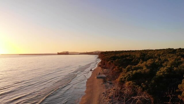 The sun touches horizon, golden hour amazing seascape, sea beach sunsets. Aerial view drone camera