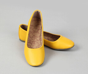 yellow flat heel ladies formal footwear isolated