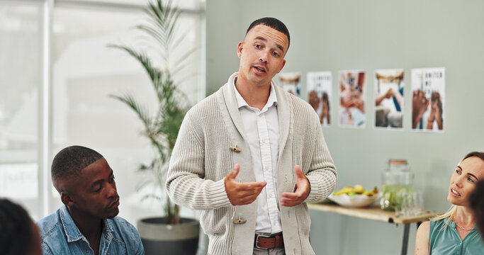 People, group counseling and man in circle at meeting with listening, advice and empathy for mental health. Talking, speaker and therapy session with support, consultation and psychology or diversity
