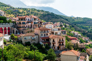 Fototapeta na wymiar Arachova, Greece. Residential buildings on the mountainside. Summer day