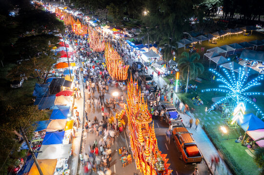 Songkhla, Thailand- 30 Oct 2023: Aerial view of the parade in traditional buddhist festival at night "Chak Pra" (Traditional Lak Phra)