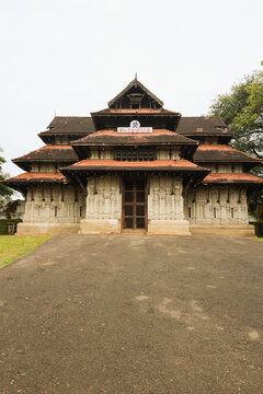 Vadakkumnathan or lord shiva ancient old traditional style south indian hindu religion stone temple building in kerala, thrissur. Front view with Om Namah Shivaya Mantra text in Malayalam