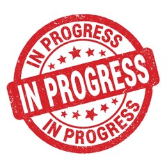 IN PROGRESS text written on red round stamp sign.
