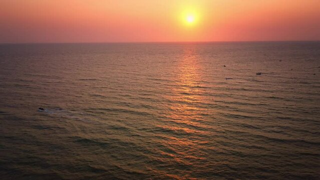 Beautiful drone shot of the golden hour, sunset at Goa's Anjuna beach in India  