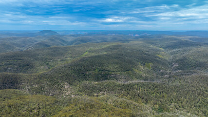 Fototapeta na wymiar Drone aerial photograph of a large hilly valley full of lush foliage near Mount Wilson in the Blue Mountains in New South Wales in Australia
