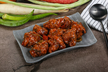 Manchurian chicken with sauce and spices