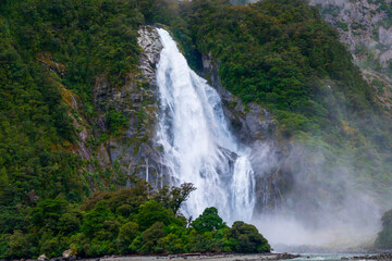 Obraz premium Photograph of Water Falls after very heavy rain and cold weather in Milford Sound in Fiordland National Park on the South Island of New Zealand