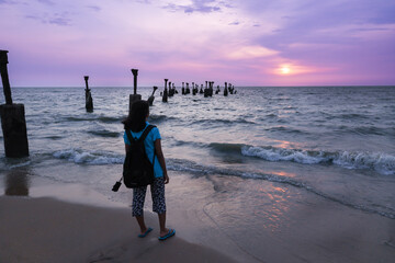 Old ruined sea piers in Calicut Kozhikode beach in Kerala India. Silhouettes of sea piers during...