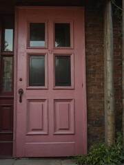 pink wooden door on old victorian house background from Generative AI
