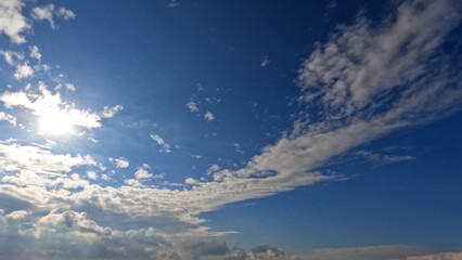 Naklejka na ściany i meble cute large bright clouds in the blue sky background - photo of nature
