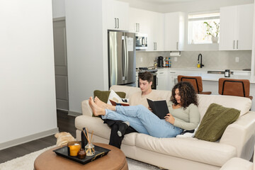 Couple enjoys a peaceful reading session together in their living room