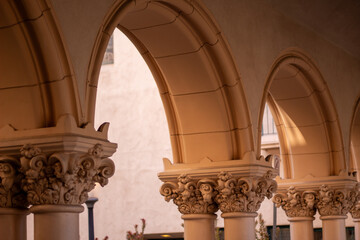 Arches of an old building with relief at sunset