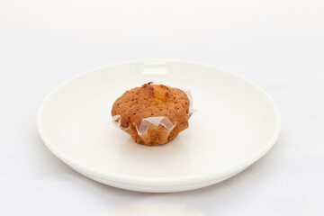 Fototapeta na wymiar A single cupcake in plate on white background