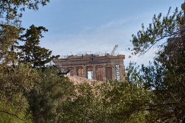Panoramic view of the Parthenon temple at the Acropolis Greece with trees in the foreground