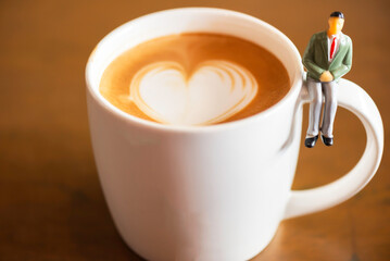Business Miniature group businessman and coffee