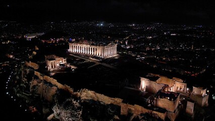 Acropolis in Greece by night , Parthenon in Athens drone aerial view, famous Greek tourist...