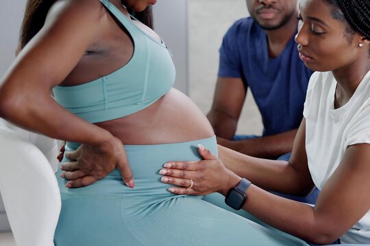 Black American Doula Providing Birth Care