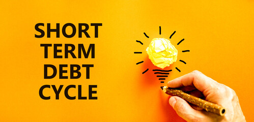 Short term debt cycle symbol. Concept words Short term debt cycle on beautiful orange paper....