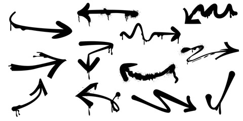 Graffiti arrows. Black arrows painted with a spray can, set.