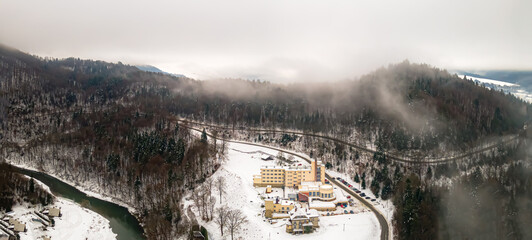 Aerial panorama of the Poprad Landscape Park on the Poprad River on a foggy,winter day.
