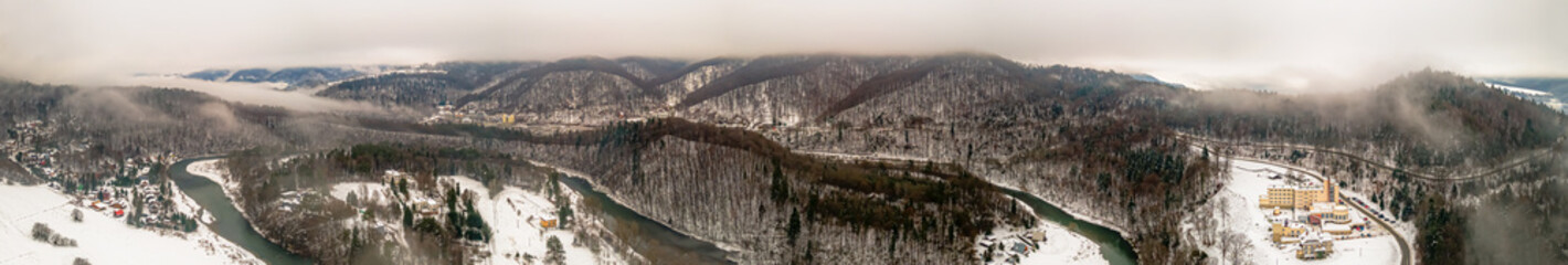 Aerial panorama of the Poprad Landscape Park on the Poprad River on a foggy,winter day.
