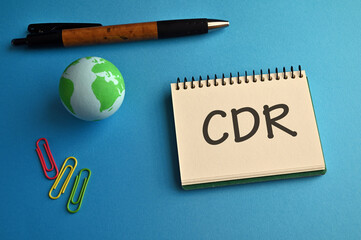 There is notebook with the word CDR. It is an abbreviation for Carbon Dioxide Removal as eye-catching image. - obrazy, fototapety, plakaty
