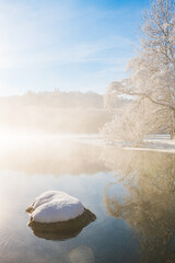 Winter Morning Mist Over the River in Mölndal, Sweden With Snow-Covered Rocks