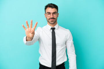 Business caucasian man isolated on blue background happy and counting four with fingers