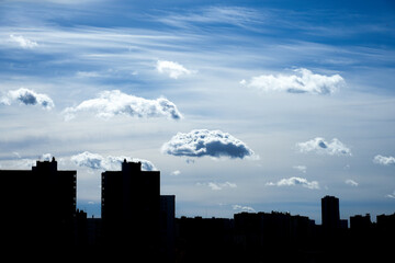 City silhouette against the blue sky and clouds. Cityscape silhouette - 783604099