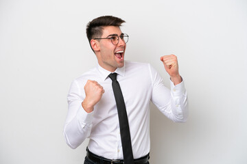 Business caucasian man isolated on white background celebrating a victory