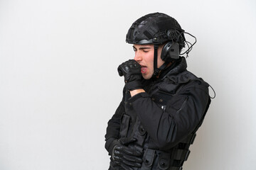 SWAT caucasian man isolated on white background is suffering with cough and feeling bad