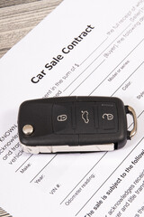 Form of car sale agreement and car key. Sales, purchases new or used vehicle