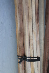 Wooden groups tied with rafia ropes

