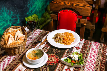 Table With Plates of Food and Bowls of Soup