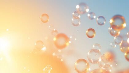 Soap bubbles on light sky background in summer
